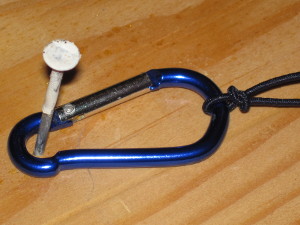 Use a mini carabiner to make it easier to pass the cord through.